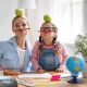 Mum and daughter have fun doing homework
