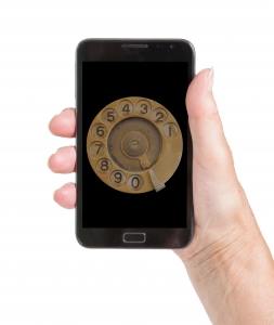 Woman hand with smart phone isolated, old fashion dial