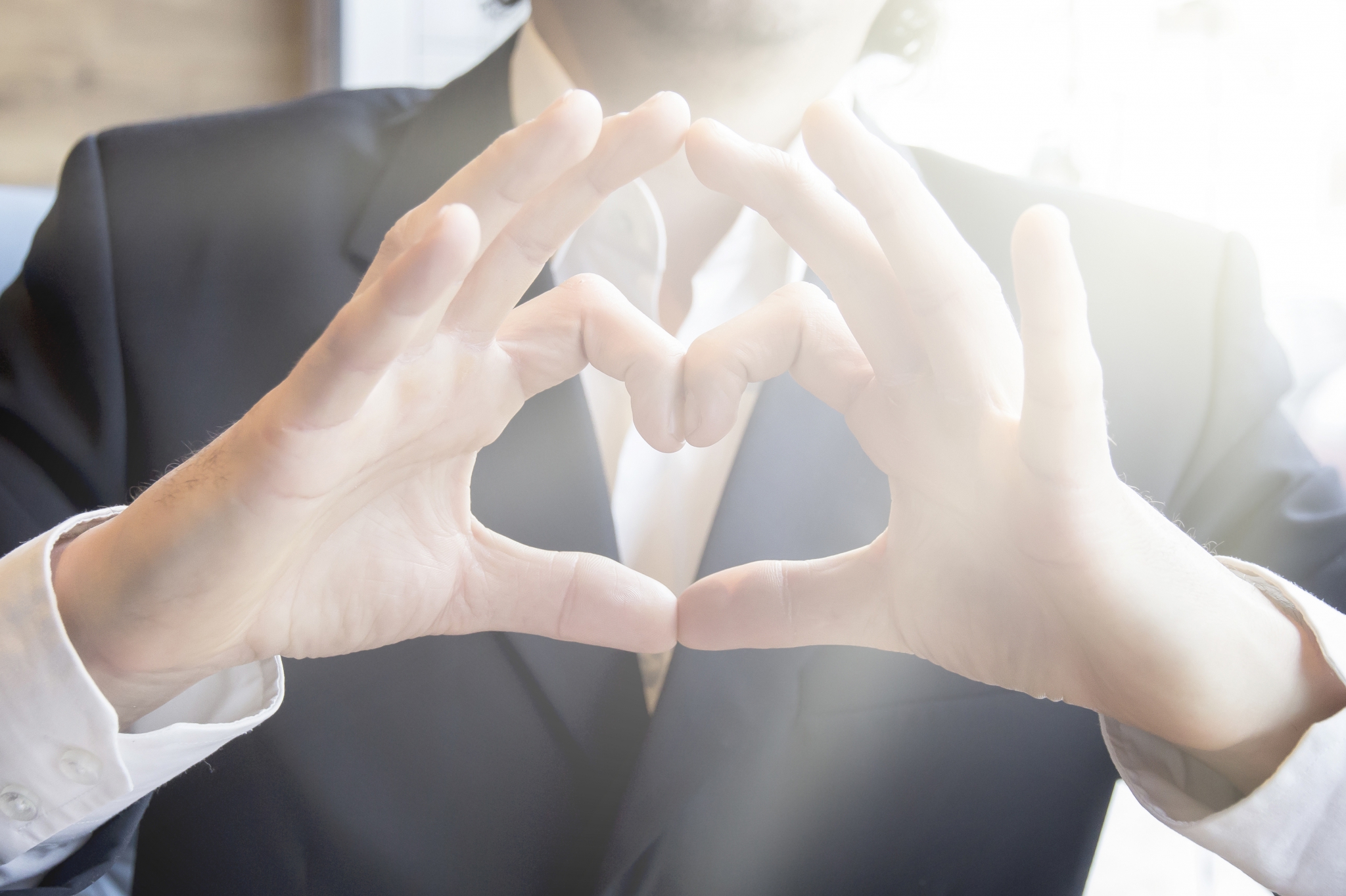 Man shows hand heart sign