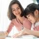 Happy mother and daughter homeschool in lockdown