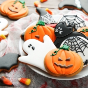 Halloween gingerbread cookies in plate on wooden table Halloween biscuits