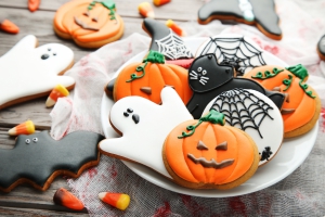 Halloween gingerbread cookies in plate on wooden table Halloween biscuits